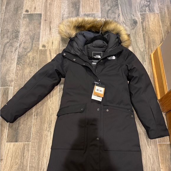 Brand new with tags!Beaitiful North Face parka.Very warm for cold winters.